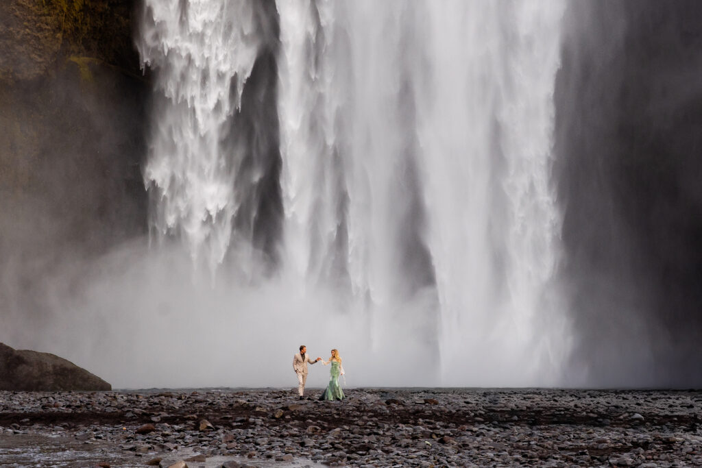 While walking side by side they are gentle feeling what Icelandic water feels like by getting misted. 